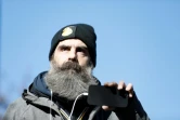 Jérôme Rodrigues, une des figures du mouvement des "gilets jaunes", filme la manifestation qui se déroule place d'Italie à Paris, le 12 février 2022