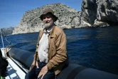 L'archéologue Michel Olive près de la grotte Cosquer, au large de Marseille, le 27 avril 2022 

