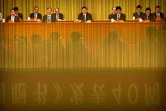 Le président chinois Xi Jinping (C) réaffirme l'intransigeance de Pékin envers Taïwan dans un discours au Palais du Peuple à Pékin, le 2 janvier 2019