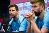 La star du Barça Lionel Messi et son coéquipier Gerard Pique ici en conférence de presse à la cité sportive Joan Gamper près de Barcelone, le 24 mai 2019