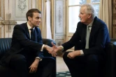 Emmanuel Macron (g) avec Michel Barnier (d), alors Négociateur en chef de l'Union européenne chargé de la préparation des relations futures avec le Royaume-Uni, à l'Elysée le 31 janvier 2020 ( AFP / Ludovic MARIN )