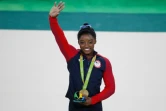 La gymnaste américaine Simone Biles, sacrée championne olympique lors du concours général individuel, le 11 août 2016 aux JO de Rio