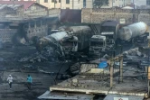 Des carcasses de camions-citernes brûléees après une explosion de gaz dans le quartier d'Embakasi à Nairobi, le 2 février 2024