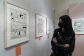 Une visiteuse regarde des planches le 22 février 2022 au musée de la BD d'Angoulême qui présente une exposition consacrée au travail de scénariste de René Goscinny