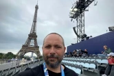 Le photographe de l'Agence France-Presse Jeff Pachoud avant la cérémonie d'ouverture des JO, le 26 juillet 2024 à Paris