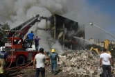 Opérations de secours sur le site d'une explosion d'origine indéterminée dans une zone commerciale d'Erevan, le 14 août 2022 en Arménie