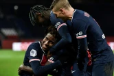 Moise Kean entouré de Marco Verratti et le titi Timothée Pembélé après avoir marqué le 4e but du PSG contre Strasbourg au Parc des Princes, le 23 décembre 2020