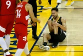 Klay Thompson des Golden State Warriors blessé lors de la finale NBA face aux Toronto Raptors, à Oakland, le 13 juin 2019