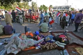 Des manifestants se reposent sur la place Tahrir, coeur de la contestation dans le centre de la capitale irakienne Bagdad, le 1er novembre 2019