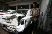 des voitures endommagées par les combats dans un garage de Mossoul-Est, le 6 septembre 2017 en Irak