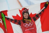 La Canadienne Kelsey Serwa en liesse sur le podium après sa victoire en finale du skicross aux JO, le 23 février 2018 à Pyeongchang 