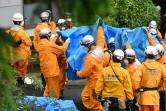 Des secouristes viennent de trouver le corps d'une des victimes du glissment de terrain à Atami (Japon), le 4 juillet 2021