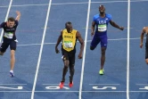 Le Jamaïcain Usain Bolt remporte la finale du 200 m devant le Canadien André De Grasse (d) et le Français Christophe Lemaître (g), lors des Jeux olympiques de Rio, le 18 août 2016
