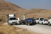 Des voitures attendent de passer à un porte contrôle en Cisjordanie occupée après une attaque meurtrière, le 11 août 2024