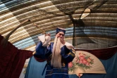 Une représentation de la troupe "Lanterne de Fleurs", à Kunming le 7 janvier 2016