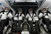 (g-d) Image d'une vidéo diffusée le 23 avril 2021 par la Nasa des astronautes Thomas Pesquet, Megan McArthur, Shane Kimbrough et Akihiko Hoshide dans la capsule Crew Dragon avant le lancement de la fusée SpaceX Falcon 9 au centre spatial Kennedy, en Floride