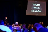 Un écran affiche "Trump remporte le Nevada" lors d'une soirée à l'occasion des caucus dans le Nevada, le 8 février 2024 à Las Vegas