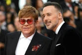 Le chanteur et compositeur britannique Elton John (g) et son mari, le producteur canadien David Furnish, le 16 mai 2019 à Cannes