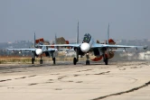 Des avions russies SoukhoÏ SU-30 SM atterrissent sur la base aérienne de Hmeimim, le 3 octobre 2015 dans la province syrienne de Lattaquié