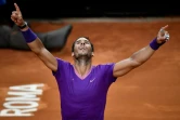 La joie de l'Espagnol Rafael Nadal, après sa victoire face au Serbe Novak Djokovic, en finale de l'Open d'Italie, le 16 mai 2021 au Foro Italico à Rome