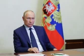 Une image diffusée par l'agence d'Etat russe Spoutnik montre le président russe Vladimir Poutine pendant une visioconférence avec le gouverneur de la région de Koursk, le 8 août 2024
