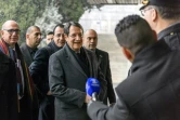 Le dirigeant chypriote grec Nicos Anastasiades (c) arrive pour le 2e jour de négociations pour la réunification de l'île, le 10 janvier 2017 à Genève