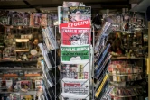 Des exemplaires de l'hebdomadaire satirique Charlie Hebdo, sur l'étalage d'un kiosquier à Lyon, le 25 février 2015 