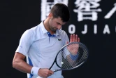 Le joueur de tennis serbe Novak Djokovic lors de sa défaite contre l'Italien Jannik Sinner en demi-finale de l'Open d'Australie à Melbourne le 26 janvier 2024