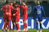 La joie des Lyonnais, après l'ouverture du score sur pénalty de leur attaquant Moussa Dembélé face à Troyes, lors de la 21e journée de Ligue 1, le 16 janvier 2022 au Stade de l'Aube