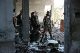Des rebelles affrontent les forces du régime à Ramussa dans le sud-ouest de Alep, le 6 août 2016
