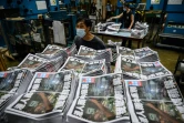 Des employés de l'Apple Daily impriment la dernière édition du quotidien pro-démocratie, le 24 juin 2021 à Hong Kong