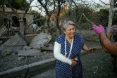 Une femme blessée devant une maison en ruines à Mykolaïv, dans le sud de l'Ukraine, le 29 août 2022