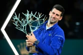 La joie du Serbe Novak Djokovic, après sa victoire face au Russe Daniil Medvedev au Masters 1000 de Paris, le 7 novembre 2021 à l'AccorHotels Arena