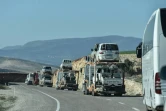 Un convoi militaire transportant des rebelles pro-turcs et leurs véhicules avance vers Kilis, près de la frontière avec la Syrie, lors de l'opération "Rameau d'olivier" contre les unités kurdes YPG, le 29 janvier 2018