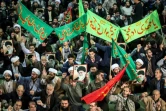 Des manifestants iraniens arborent des portraits du numéro un Ali Khamenei lors d'un rassemblement de soutien au gouvernement à Téhéran, le 30 décembre 2017