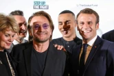 Emmanuel Macron (D), Le styliste Olivier Rousteing (2e-D) et le chanteur d'U2 
Bono (G), à la conférence du Fonds mondial de lutte contre le sida, la tuberculose et le paludisme à Lyon, le 9 octobre 2019