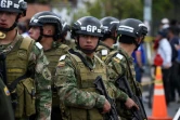 Les forces de sécurité montent la garde près d'une école de police cible d'un attentat à la voiture piégée le 17 janvier 2019 à Bogota 