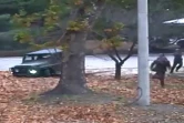Capture d'image d'une vidéo fournie par le Commandement des Nations Unis en Corée montrant des soldats nord-coréens à la poursuite d'un militaire nord-coréen faisant défection, le 22 novembre 2017 à proximité de la Zone démilitarisée