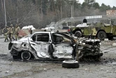 Voiture détruite par un bombardement à un barrage de la ville de Brovary en banlieue de Kiev, le 1er mars 2022