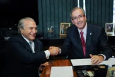 Le président conservateur Michel Temer (G) et Eduardo Cunha, ex-président de la chambre des députés, actuellement en prison, sont pris en photo ensemble le 10 mars 2015 à Brasilia