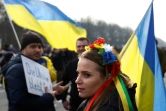 Une manifestante dénonçant l'invasion russe en Ukraine, à Berlin, le 27 février 2022.