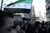 Des syriens manifestent contre le régime à Saqba, dans la banlieue est de Damas, le 30 décembre 2016, premier jour d'une trêve nationale