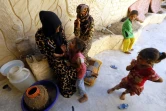 Une famille syrienne réfugiée dans le quartier Sabahiya de Raqa, le 14 août 2017