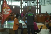 Capture d'image tirée d'une vidéo de l'AFPTV montrant des manifestants au sein de l'hémicycle du Conseil régional de la Guadeloupe, le 23 décembre 2021