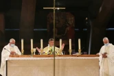 Mgr Michel Aupetit (C) célèbre une messe à Lourdes (France), le 15 août 2021