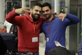Des réfugiés syriens, qui ont obtenu des visas humanitaires du gouvernement italien, attendent dans la salle des départs de l'aéroport international de Beyrouth le 1er mars 2017 avant leur vol pour Rome