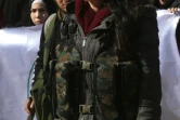 Une civile kurde  turque ayant rejoint les rangs des combattants pour lutter contre l'offensive turque en cours contre la région d'Afrine dans le nord-ouest de la Syrie. Photo prise le 28 janvier 2018 à Afrine