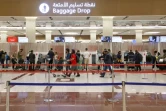Des voyageurs à l'aéroport international de Dubaï, le 21 février 2022