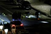 Des enquêteurs sur les lieux où deux personnes ont été tuées par la police à Paris sur le Pont Neuf le 25 avril 2022 