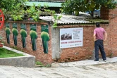 Panneaux publicitaires à l'effigie d'éléphants aux environs d'une réserve dans la ville de Xiangyanjing, en Chine, le 20 juillet 2021